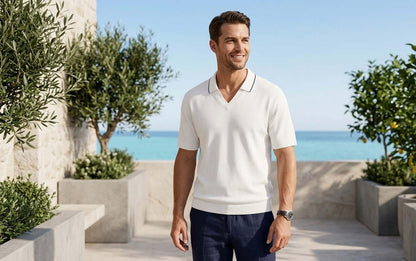 Man wearing HARVIAN Amalfi V-Neck T-shirt, standing outdoors with sea view, showcasing comfortable style.